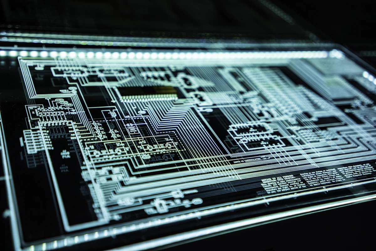 Glowing circuit-board traces on a dark screen