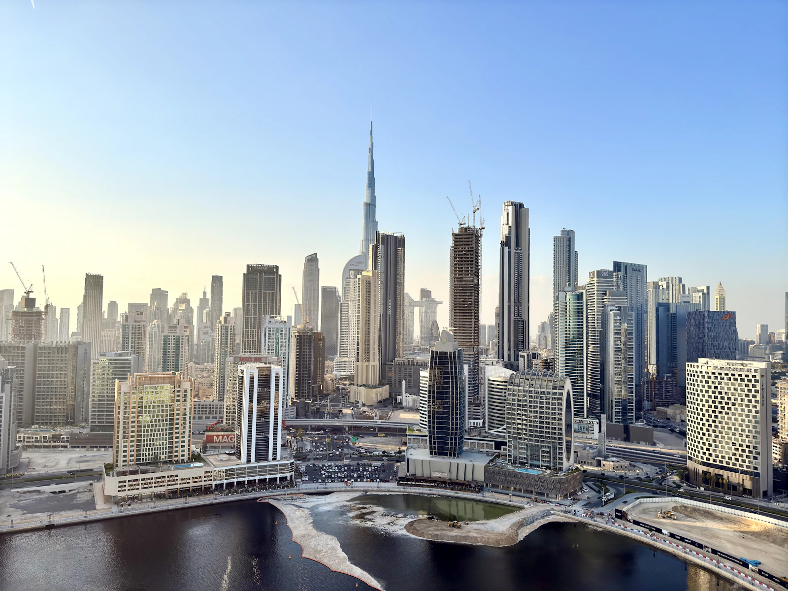 Dubai skyline with Burj Khalifa behind water, near DIFC, where finance and legal firms need strong IT security